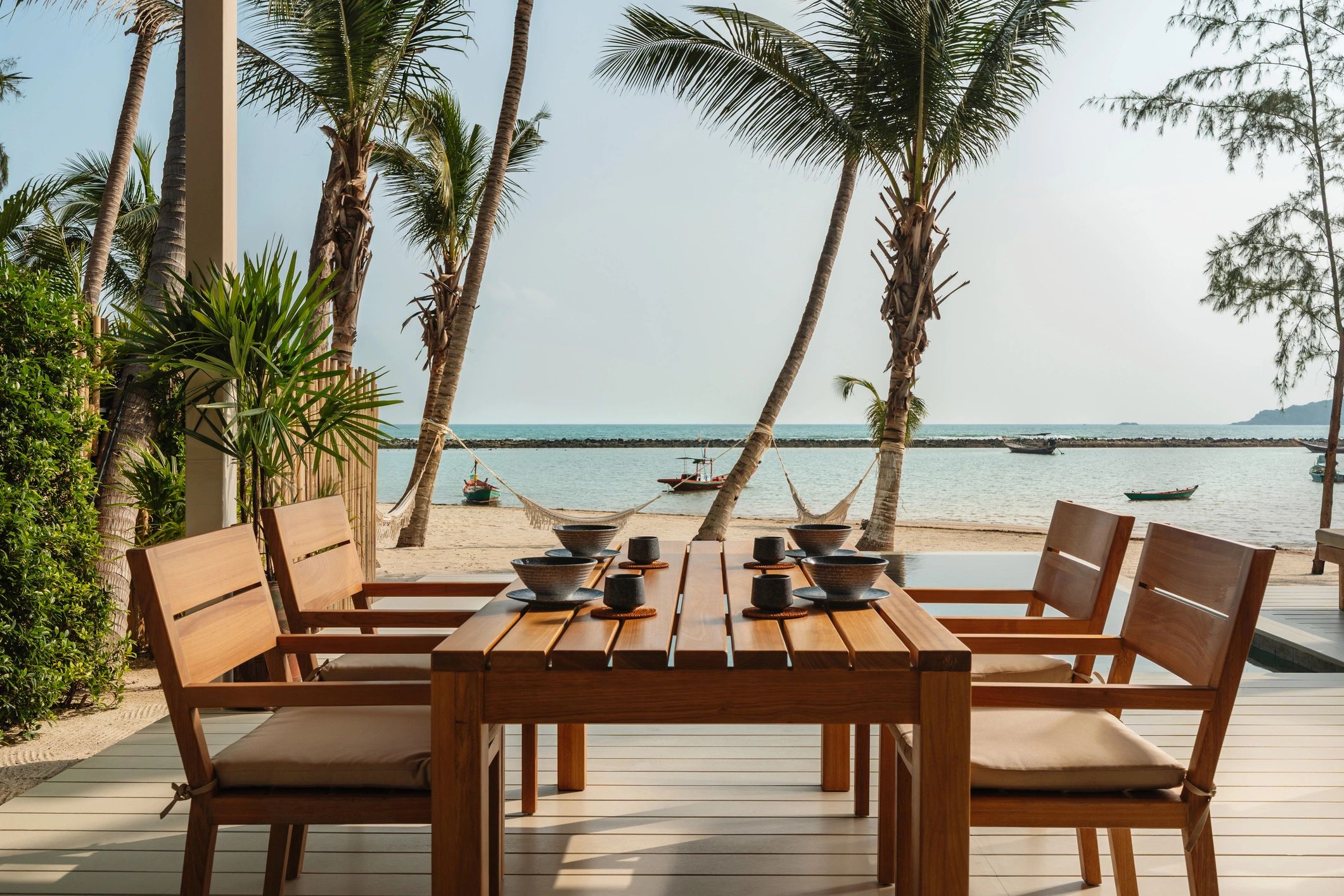 Outdoor dining area at a beachfront villa